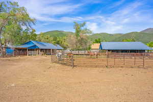 Stable featuring a mountain view and a view of countryside