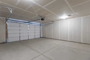 Garage featuring a garage door opener