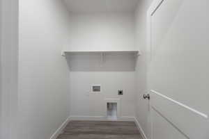 Laundry area featuring electric dryer hookup, wood finished floors, baseboards, and hookup for a washing machine
