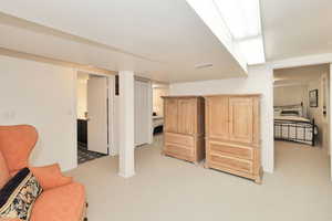 Living area with light colored carpet