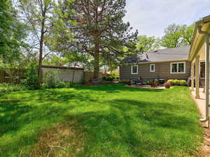 View of yard with a patio and cooling unit