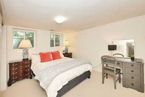 Carpeted bedroom with baseboards