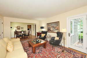 Living room with wood finished floors and baseboards