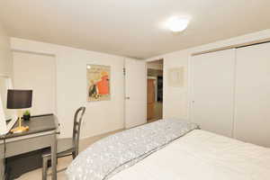 Bedroom with a closet, carpet floors, and baseboards
