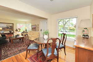 Dining room with light wood-style flooring and baseboards