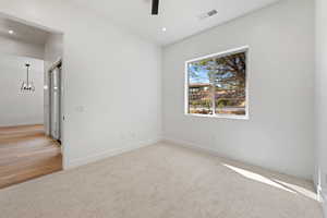 Spare room with baseboards, ceiling fan, carpet, and recessed lighting