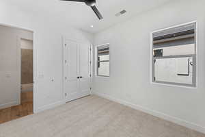 Unfurnished bedroom featuring carpet floors, baseboards, a closet, and a ceiling fan