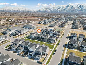 Aerial perspective of suburban area with a mountainous background