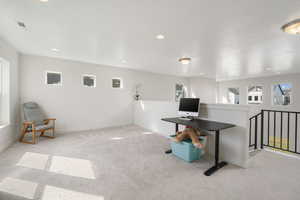 Game room with carpet floors, recessed lighting, and baseboards