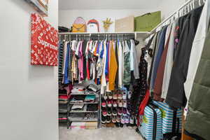 Spacious closet with carpet floors