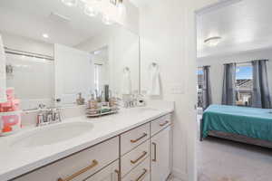 Ensuite bathroom featuring double vanity