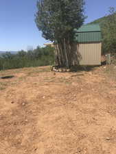 View of yard featuring a large  12.5' x 16.5' shed