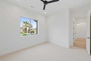Unfurnished bedroom featuring carpet, baseboards, recessed lighting, and a ceiling fan