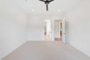 Unfurnished room with baseboards, light colored carpet, and recessed lighting