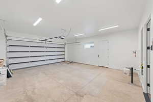 Garage featuring a garage door opener