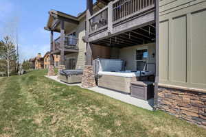 Exterior space with a hot tub