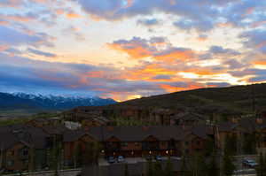 View of mountain background featuring nearby suburban area
