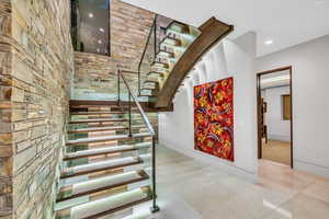 Stairs featuring tile patterned floors