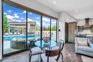 Dining space featuring wood finish floors and recessed lighting