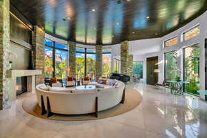 Lobby with a high ceiling, wooden ceiling, and recessed lighting