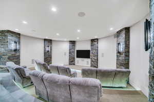 Living area featuring baseboards and recessed lighting