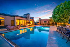 View of swimming pool with a patio area and an outdoor living space