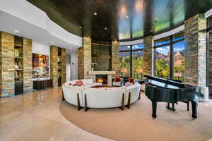 Building lobby with a mountain view, a high ceiling, and recessed lighting