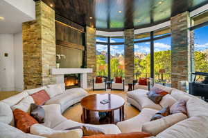 Living area with recessed lighting, a fireplace, carpet flooring, and wooden ceiling