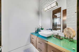 Bathroom featuring vanity and tile patterned floors