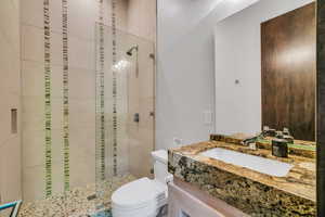Full bathroom with a stall shower and vanity