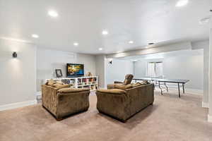Generously sized family room with ample space for a rec area, perfect for entertaining, relaxation, or a game space. A versatile room designed for both comfort and enjoyment.