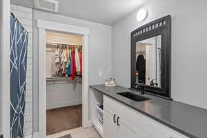 Ensuite bathroom featuring stylish finishes, a spacious layout, and direct access from the bedroom—designed for comfort and privacy
