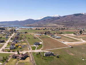 View of property location featuring a water and mountain view, property boundaries highlighted, and rural landscape
