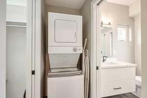 Laundry area with estacked washer and dryer