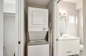 Laundry room with estacked washer and dryer