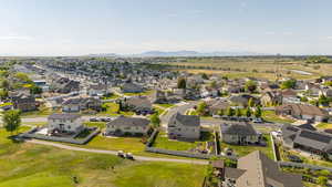 Aerial perspective of suburban area with a mountain backdrop
