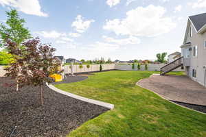 View of yard with a playground, a residential view, a patio area, and stairs