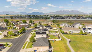 Aerial view of residential area featuring a mountain backdrop