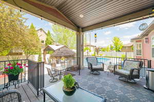 View of patio with a fenced backyard, a Trex deck, and outdoor lounge area