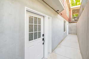 Private Entrance to ADU featuring stucco siding
