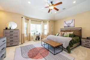 Primary Bedroom with light colored carpet, recessed lighting, a ceiling fan, and baseboards