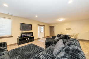 ADU Living room featuring recessed lighting and baseboards