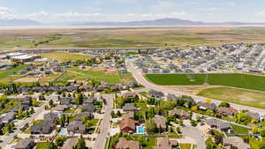 Aerial perspective of suburban area with a mountain backdrop