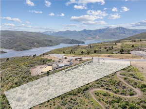View of mountain backdrop featuring a large body of water
