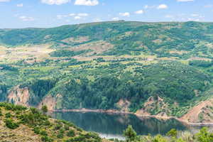 View of mountain backdrop with a nearby body of water