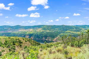 View of mountain background featuring a nearby body of water