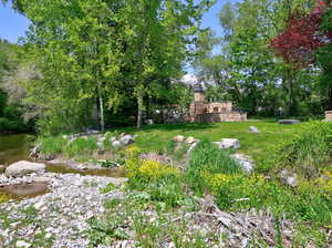 View of yard featuring view of wooded area