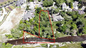 Aerial view of residential area with property parcel outlined