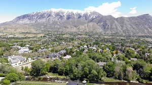 Aerial view of property's location featuring a mountainous background