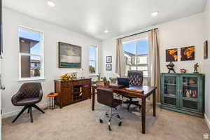 Office featuring light carpet, baseboards, and recessed lighting